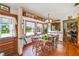 An inviting dining area with a table set and views of the backyard pool at 2704 Burgoyne Pl, Deland, FL 32720