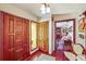 Welcoming foyer featuring decorative wooden doors and hardwood floors at 2704 Burgoyne Pl, Deland, FL 32720