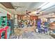 Spacious garage with multiple ceiling fans, room for storage, work benches and a side entrance at 2704 Burgoyne Pl, Deland, FL 32720