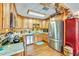 A cozy kitchen featuring stainless steel appliances, wood cabinets, and bright lighting at 2704 Burgoyne Pl, Deland, FL 32720