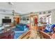 Cozy living room featuring wood accents and a view into the kitchen at 2704 Burgoyne Pl, Deland, FL 32720