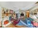 Charming living room with a striking stone fireplace and an inviting atmosphere at 2704 Burgoyne Pl, Deland, FL 32720