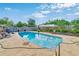 Inviting backyard pool with clear blue water and well-maintained landscaping surrounded by a concrete deck at 2704 Burgoyne Pl, Deland, FL 32720