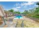 The backyard is the perfect space for entertaining with a gorgeous blue pool and patio at 2704 Burgoyne Pl, Deland, FL 32720