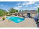 Enjoy the sparkling blue pool and ample patio space in this home's backyard at 2704 Burgoyne Pl, Deland, FL 32720