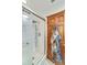 Walk-in shower with modern fixtures and a glass door, showcasing clean design and functionality at 2704 Burgoyne Pl, Deland, FL 32720