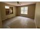 A room with a fan, tiled floors, and boarded windows at 288 Mcmillon Dr, Orange City, FL 32763