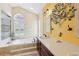 Bathroom with soaking tub, natural light, and dual sink vanity with traditional style at 2940 Se 23Rd Ave, Ocala, FL 34471