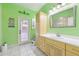Bright bathroom with a colorful painted wall and door to an outdoor patio at 2940 Se 23Rd Ave, Ocala, FL 34471