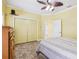 Bright bedroom features a ceiling fan, closet, and tiled floor for a cozy and inviting atmosphere at 2940 Se 23Rd Ave, Ocala, FL 34471