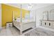 Bedroom with white 4-poster bed, tile flooring, yellow accent wall, and shuttered windows at 2940 Se 23Rd Ave, Ocala, FL 34471