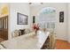 Bright dining room boasts an arched window and double-door entry at 2940 Se 23Rd Ave, Ocala, FL 34471