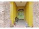 Inviting entryway with double doors, brick columns, seating and a welcome mat at 2940 Se 23Rd Ave, Ocala, FL 34471