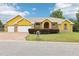 Charming single-story home with a two-car garage, brick accents and manicured front lawn at 2940 Se 23Rd Ave, Ocala, FL 34471
