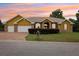 Charming single-story home with a two-car garage, brick accents and manicured front lawn at 2940 Se 23Rd Ave, Ocala, FL 34471
