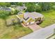 Expansive yellow single-Gathering home with a brick driveway, two-car garage, and lush green lawn at 2940 Se 23Rd Ave, Ocala, FL 34471