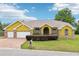Charming single-Gathering home with a three-car garage, well-manicured lawn and brick-paved driveway at 2940 Se 23Rd Ave, Ocala, FL 34471