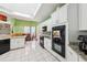 A well lit kitchen with a central island, white cabinetry, and stainless appliances at 2940 Se 23Rd Ave, Ocala, FL 34471