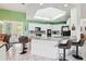 Bright open kitchen with a center island, bar seating, and stainless steel appliances at 2940 Se 23Rd Ave, Ocala, FL 34471