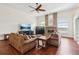 Inviting living room boasts natural light, wood floors and brick fireplace at 2940 Se 23Rd Ave, Ocala, FL 34471