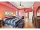 Cozy main bedroom with a sitting area, a ceiling fan, and stylish decor at 2940 Se 23Rd Ave, Ocala, FL 34471
