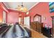 Open main bedroom with dark furniture, wood floors, and a large dresser at 2940 Se 23Rd Ave, Ocala, FL 34471