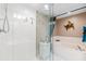 Bright bathroom featuring a walk-in shower and soaking tub with a glass door at 2967 S Atlantic Ave # 1601, Daytona Beach Shores, FL 32118