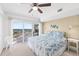 Bedroom featuring sliding doors to a balcony overlooking the cityscape at 2967 S Atlantic Ave # 1601, Daytona Beach Shores, FL 32118