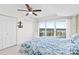 Bedroom with a fan, closet, and sliding glass doors to a balcony overlooking the city at 2967 S Atlantic Ave # 1601, Daytona Beach Shores, FL 32118