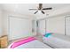 Bedroom featuring two twin beds, ceiling fan, a closet, and a view from the window at 2967 S Atlantic Ave # 1601, Daytona Beach Shores, FL 32118