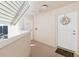 Hallway featuring unit entrance and access to building amenities, enhanced by neutral tones at 2967 S Atlantic Ave # 1601, Daytona Beach Shores, FL 32118