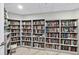 Floor to ceiling library featuring rows of bookshelves filled with a variety of books at 2967 S Atlantic Ave # 1601, Daytona Beach Shores, FL 32118