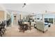 Expansive living room featuring ample seating, mirrored walls, and dining area, enhancing spaciousness and social interaction at 2967 S Atlantic Ave # 1601, Daytona Beach Shores, FL 32118