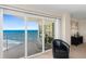 Relax in this comfortable living room with sliding glass doors to a private ocean-view balcony at 2967 S Atlantic Ave # 1601, Daytona Beach Shores, FL 32118