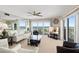 Bright living room featuring floor-to-ceiling windows with stunning waterfront views and elegant furnishings at 2967 S Atlantic Ave # 1601, Daytona Beach Shores, FL 32118