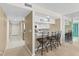 Open living space with bar seating leading into the kitchen, creating a seamless flow for entertaining and everyday living at 2967 S Atlantic Ave # 1601, Daytona Beach Shores, FL 32118
