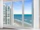 Breathtaking ocean view from a large window, showcasing the beach and waves at 2967 S Atlantic Ave # 1601, Daytona Beach Shores, FL 32118