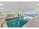 Indoor swimming pool with walls of windows and beautiful blue water at 2967 S Atlantic Ave # 1601, Daytona Beach Shores, FL 32118