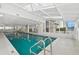 Indoor swimming pool with walls of windows and beautiful blue water at 2967 S Atlantic Ave # 1601, Daytona Beach Shores, FL 32118