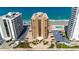 Aerial view of a condo complex showing the building's layout, pool, and beach access at 3023 S Atlantic Ave # 4020, Daytona Beach, FL 32118