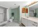 Well-lit bathroom featuring a shower-tub combo, patterned flooring, and a vanity with storage at 3023 S Atlantic Ave # 4020, Daytona Beach, FL 32118