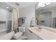 Bright bathroom with a shower-tub combo, ample countertop space, and neutral finishes for a clean aesthetic at 3023 S Atlantic Ave # 4020, Daytona Beach, FL 32118