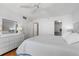 Bright bedroom with a ceiling fan, tile floors, and ample closet space providing organized storage at 3023 S Atlantic Ave # 4020, Daytona Beach, FL 32118