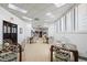 Bright common room with tables, chairs, and an exit, perfect for community gatherings and relaxation at 3023 S Atlantic Ave # 4020, Daytona Beach, FL 32118