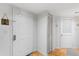Clean and functional entryway with a classic white door, closet, and neutral decor at 3023 S Atlantic Ave # 4020, Daytona Beach, FL 32118