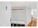 Welcoming entryway featuring a coat rack, cushioned bench with storage, and seamless access to the living area at 3023 S Atlantic Ave # 4020, Daytona Beach, FL 32118
