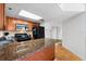 Well-lit kitchen featuring granite countertops, wooden cabinets, and modern appliances at 3023 S Atlantic Ave # 4020, Daytona Beach, FL 32118