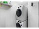 Stacked washer and dryer setup, maximizing space in this efficient laundry area at 3023 S Atlantic Ave # 4020, Daytona Beach, FL 32118