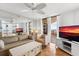 Comfortable living room featuring mirrored wall, neutral furniture, and access to a balcony with great views at 3023 S Atlantic Ave # 4020, Daytona Beach, FL 32118