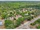 Expansive aerial view of a rural property featuring mature trees, a home with a pool, and a long driveway at 31544 Wekiva River Trl, Sorrento, FL 32776